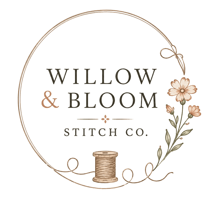 Willow & Bloom Stitch Co. A ring of thread, a wooden spool, and wildflowers.